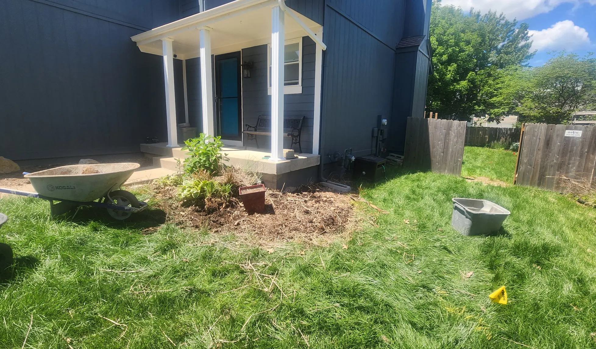 Front porch landscape bed before clearing and block installation
