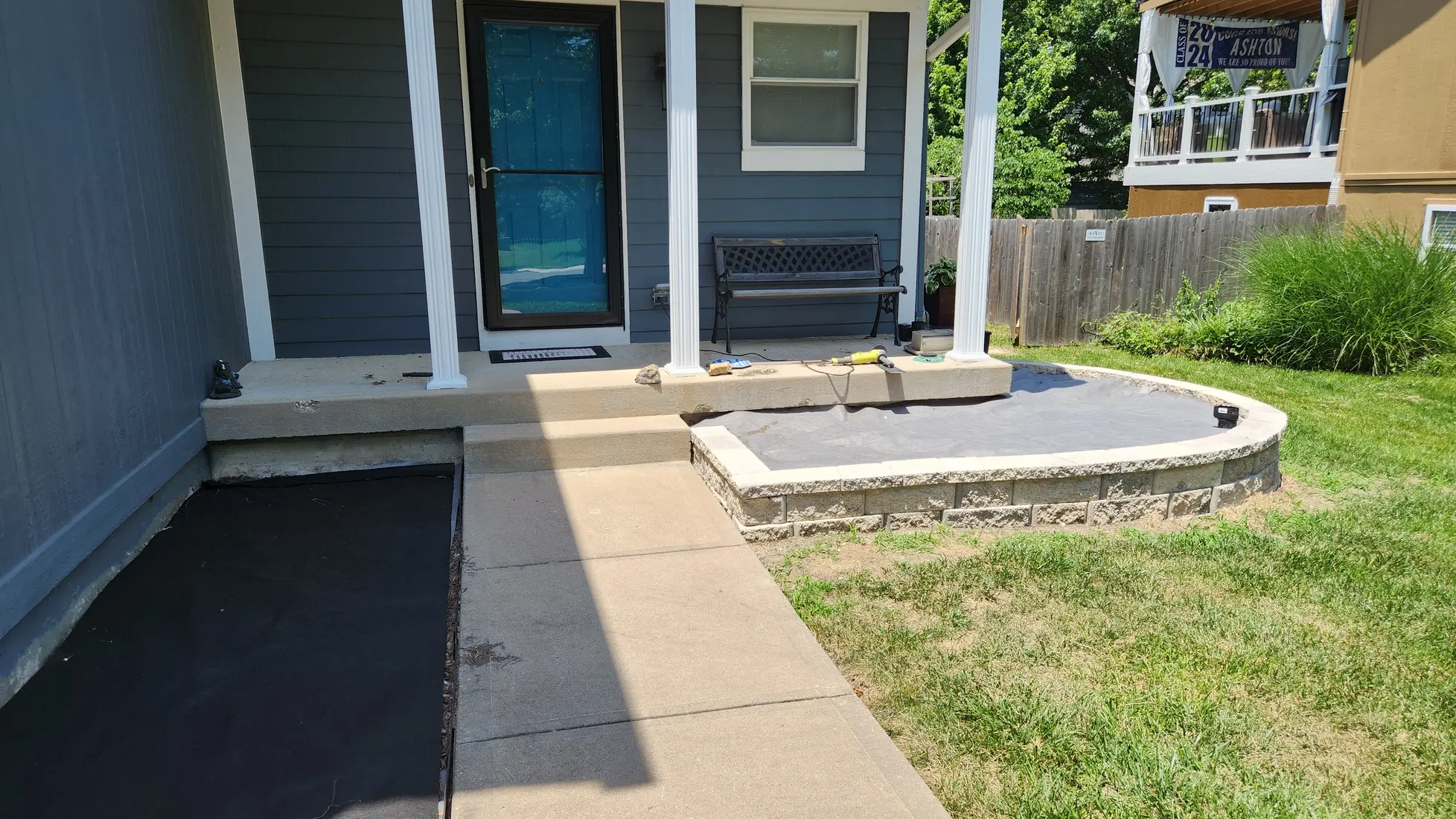 Low block landscape wall and fabric during front bed construction
